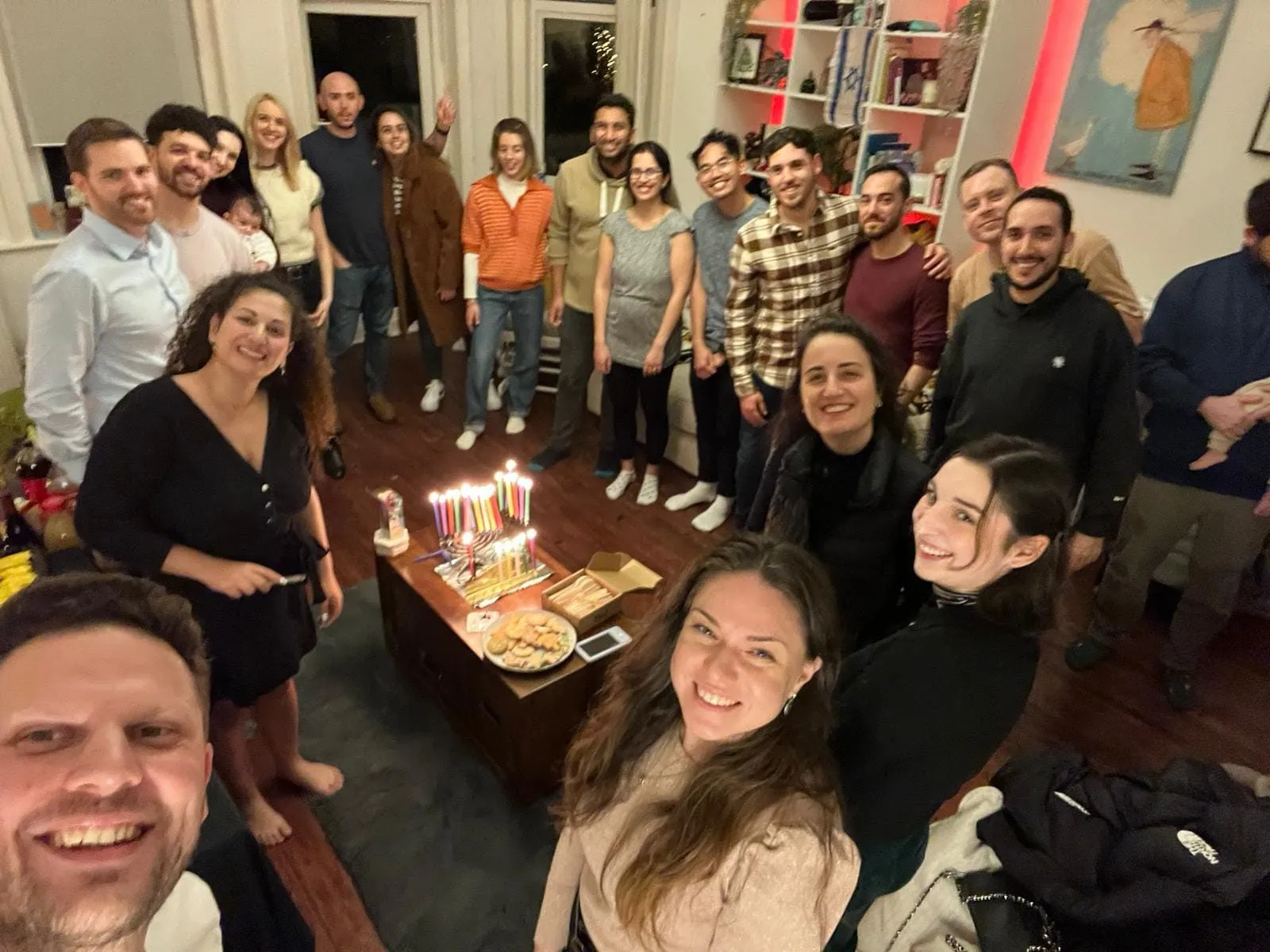 The HBayit community gathered in a living room for Chanukah